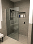 Thumbnail of Black rail shower head with10mm Glass Fixed Panel, and shower wall niche